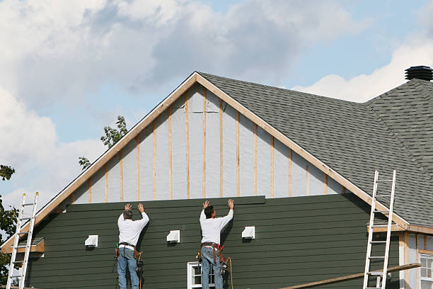 Professional Storm Damage Siding Repair technician working in Moscow, PA